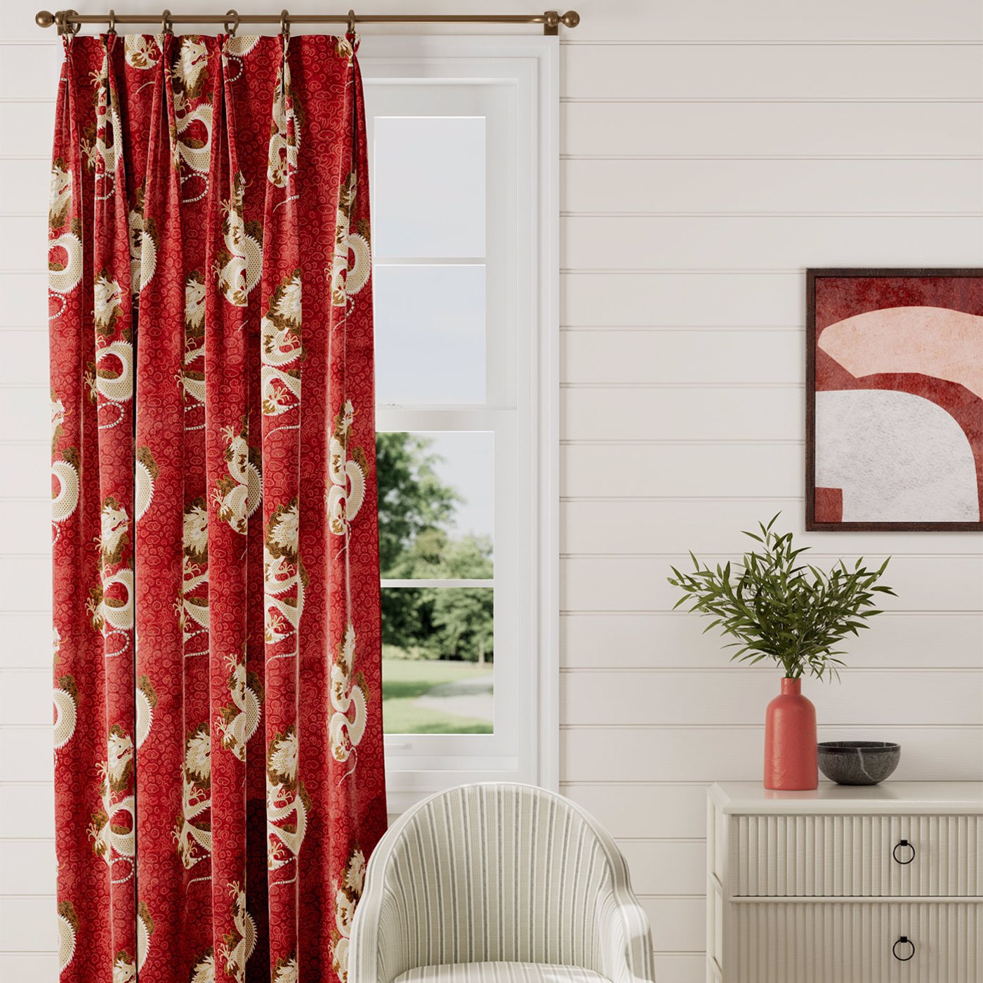 red and patterned curtain in front of a closed window with white walls